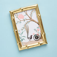 Load image into Gallery viewer, The gorgeous faux bamboo picture frame from Two's Company will have them ready for the perfect baby picture. It can hang or stand horizontally or vertically.