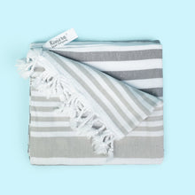 Load image into Gallery viewer, The finely loomed 100% Turkish cotton towel with hand tied tassels is super soft, made to last and will get softer after every use.