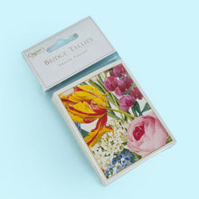 Load image into Gallery viewer, Caspari’s Redoute bridge set is from the collections of the New York Botanical Gardens and showcases Pierre-Joseph Redouté’s traditional floral compositions. The beautiful tulips are featured on the set of coordinating jumbo type playing cards, twelve bridge tallies, and a bridge score pad with 39 pages.