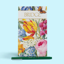 Load image into Gallery viewer, Caspari’s Redoute bridge set is from the collections of the New York Botanical Gardens and showcases Pierre-Joseph Redouté’s traditional floral compositions. The beautiful tulips are featured on the set of coordinating jumbo type playing cards, twelve bridge tallies, and a bridge score pad with 39 pages.
