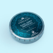 Load image into Gallery viewer, Harney & Sons’ Earl Grey Imperial tea is a fine, medium-bodied black tea with a rich swirl of bright, lemony bergamot. Each tagalong tin carries 5 sachets and a cup of tea is always good for restoring spirits.