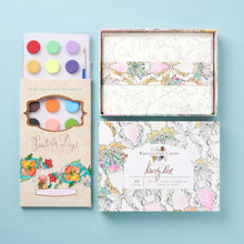 Load image into Gallery viewer, Artist Kristy Rice makes watercolors accessible to all levels of painters. This giftbox features her set of 12 Painterly Days cards, each featuring a beautiful and unique design. Printed on high-quality textured art paper, they can be mailed to friends with the accompanying envelopes or framed to brighten up a room.
