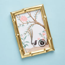 Load image into Gallery viewer, The gorgeous faux bamboo picture frame from Two&#39;s Company will have them ready for the perfect baby picture. It can hang or stand horizontally or vertically.
