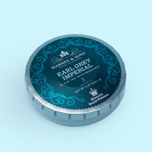 Load image into Gallery viewer, This Earl Grey tea from Harney &amp; Sons is crafted for a bold taste and packed in a decorative tin and delivers a light-bodied cup brimming with aromatic citrus notes.
