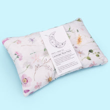 Load image into Gallery viewer, The handmade Lavender therapeutic wildflower rice pack helps with migraines, sore muscles, congestion and other aches and injuries. It can be used hot or cold.

